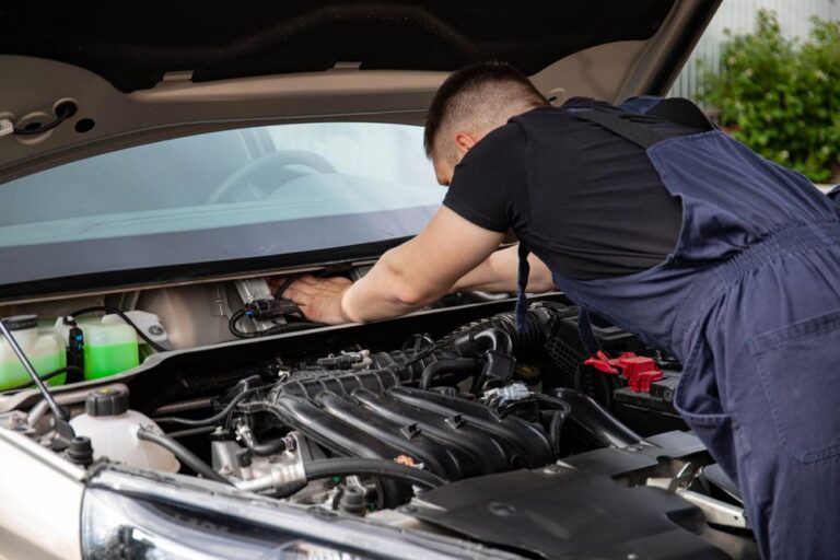 Mechanic working on a car engine