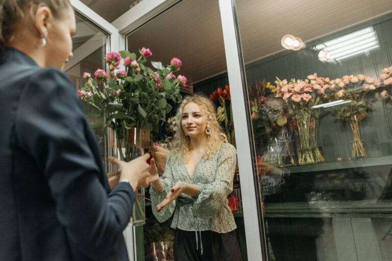 Florist serving a customer in a local shop
